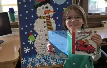 Zakończenie akcji &quot;Książki w bibliotece wypożyczamy, bałwanka w kule śniegowe ubieramy!&quot; 6
